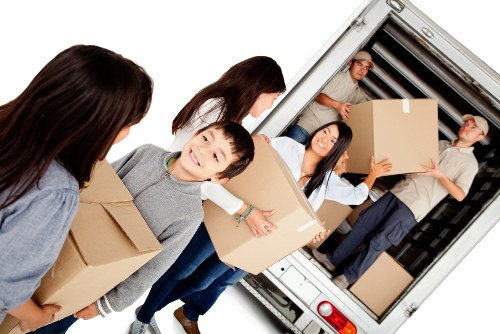 Unpacking service helping arrange boxes in a West Kensington home