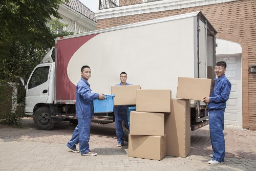 Removal team loading furniture with safety equipment at Westkensington Removals