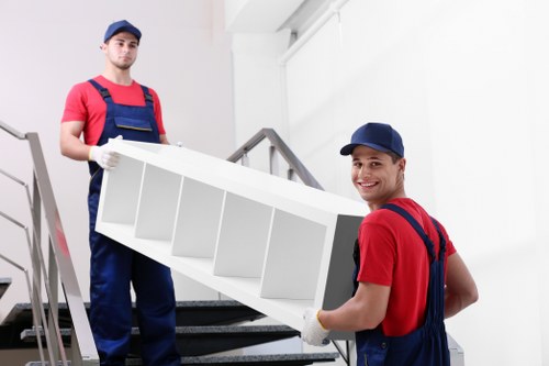 Moving home in West Kensington with boxes and furniture being prepared for transport