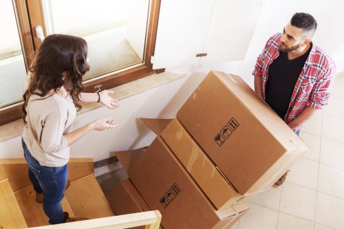 Packed boxes and furniture ready for transport during a West Kensington house move